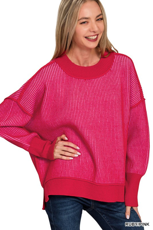 Woman wearing a bright pink sweater on a white background