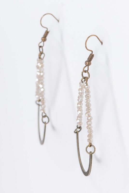Bronze fishhook drop earrings. Teardrop sham with glass beads. Lightweight. Length: 2" Width: 1"