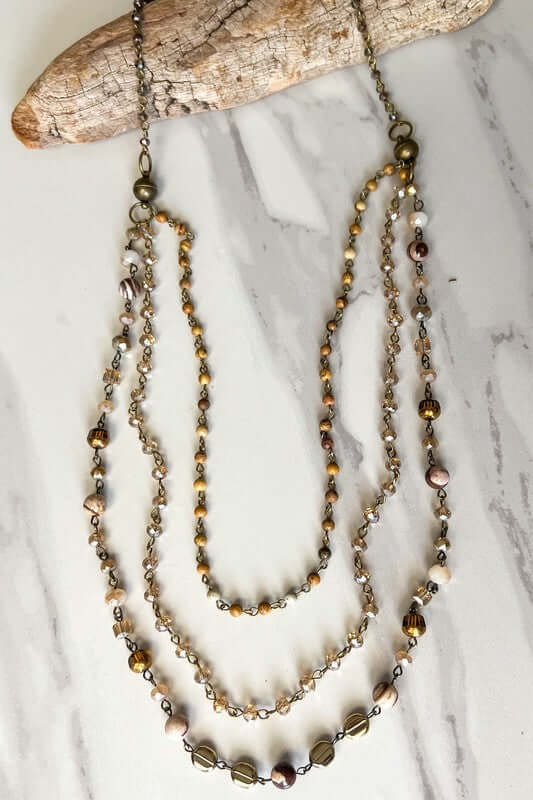 The magnetic closure allows you to adjust this piece to your liking. You can wear it as one long necklace with the bottom piece being 3 layers of beautiful beading.