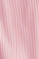 Close-up of pink fabric with subtle stripes