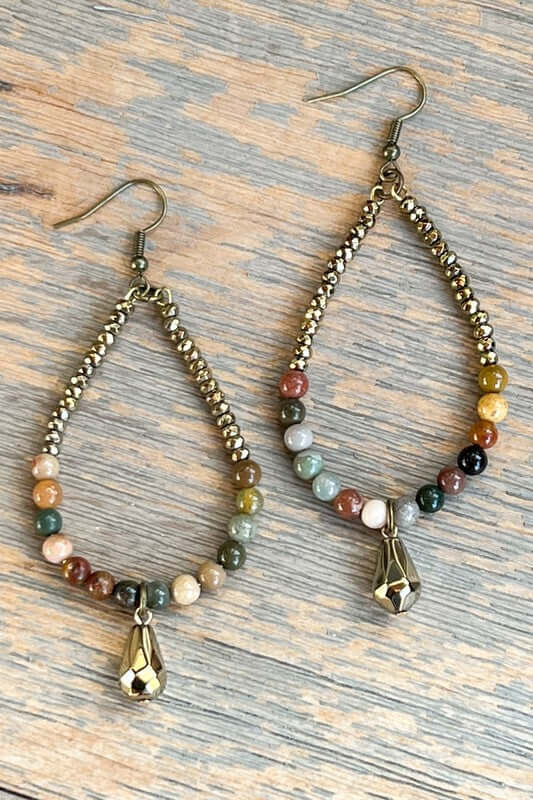 Fishhook beaded, teardrop shaped hoop earrings with a small gold dangle bead. Lightweight. Feature African Turquoise stone and gold crystal beads.