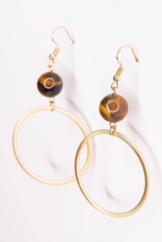 These dangle and drop fishhook earrings are a simple statement. They have a natural stone bead with a gold hoop that drops below it. Lightweight.