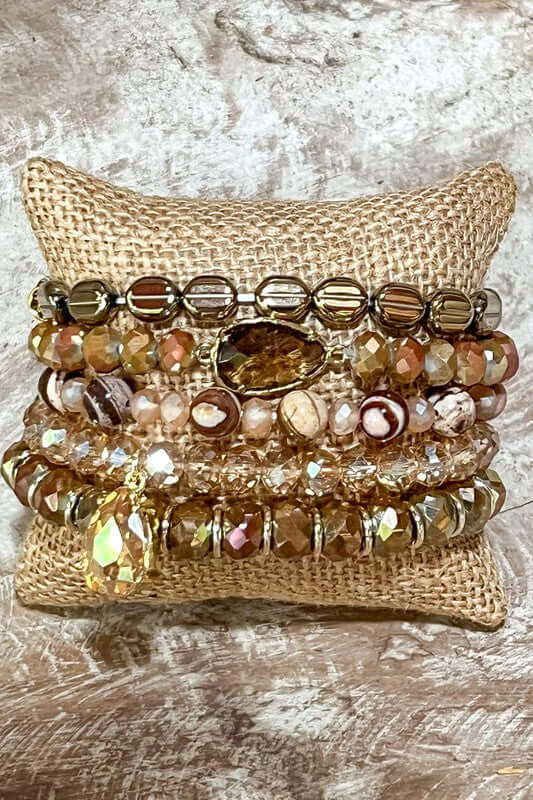Set of bracelets including 5 beaded stretch bracelets that each have their own unique features