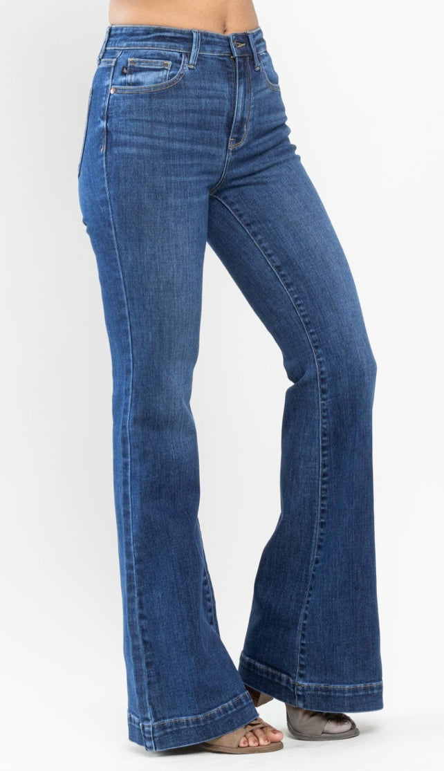 Blue jeans being worn on a white background