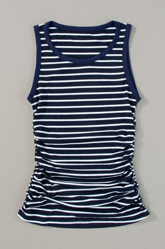 Navy and white striped tank top on a gray background