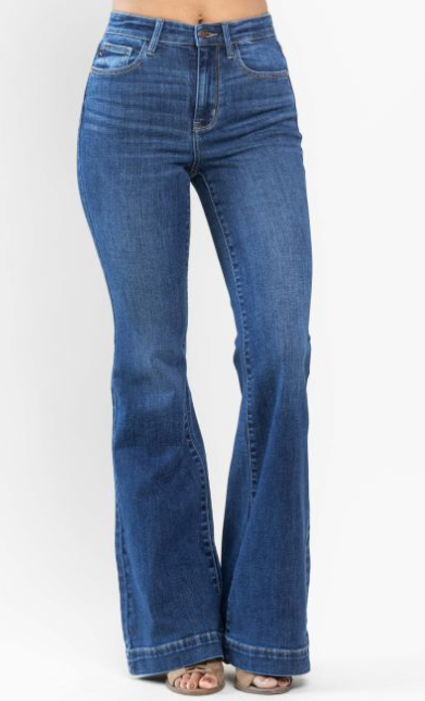 Blue flared jeans on a white background