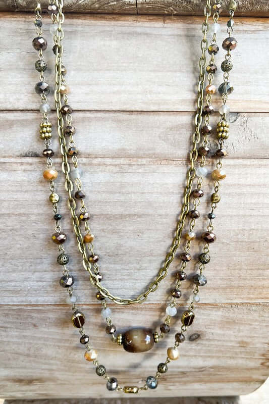 Multistrand beaded necklace on a wooden surface